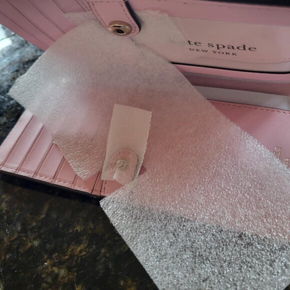 NWOT Kate Spade Pink Wallet measures 6 3/4in by 3 3/4 in - Picture 2 of 3